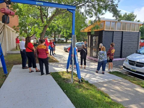 Tour participants learn about the 3D printed sample home.