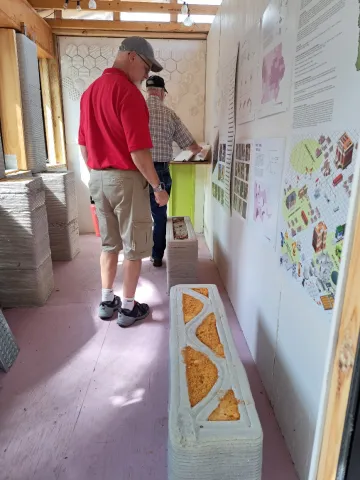 Tour participants view information and samples inside the model home.