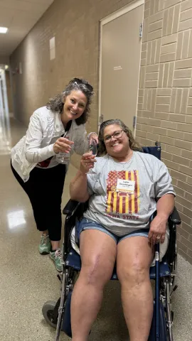 Region 18 Director Tanya Michener (left) and Jasper County council member Lynn Dunsbergen (right) enjoy a tasting of ISU wine.