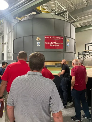 Tour Group A learned about the tornado simulator.