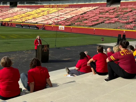 ISU President Wendy Wintersteen addresses extension council members in Jack Trice Stadium