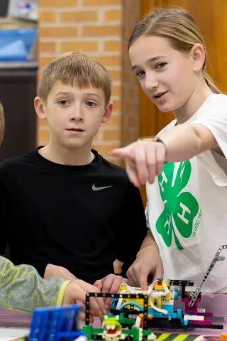 Two 4-H youth working on a Lego Robotics project